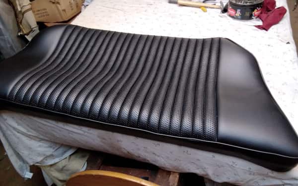 Trimming Department - Finished large leather seat after restoration - AM Restoratiions